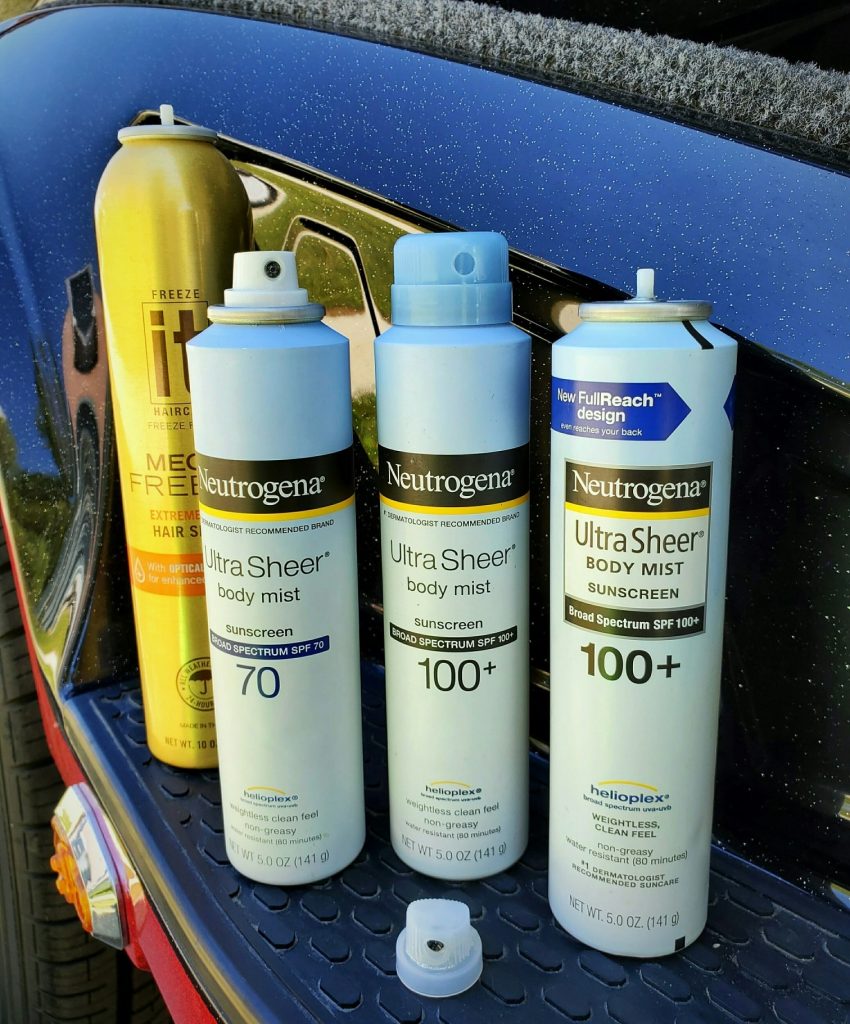 Sunscreen Tip: Neutrogena bottles and a It hairspray bottle with the caps taken off so you can see you can switch the caps between the bottles.