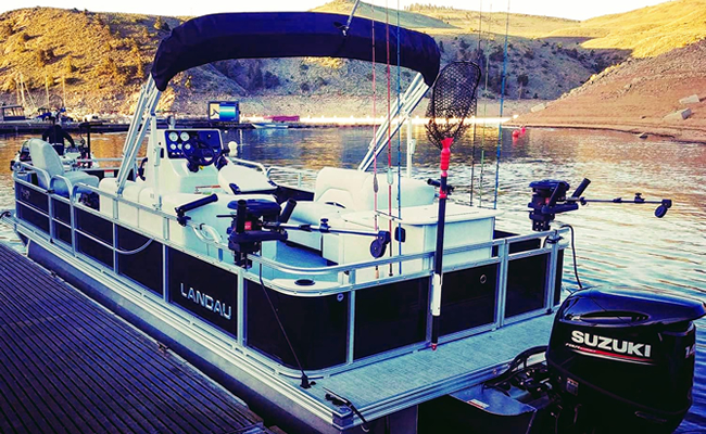 GSO Fishing - Andy Cochran's Landau Pontoon Guide Boat waiting at the doc